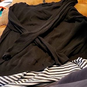 Black sweater with black and white stripped bottom